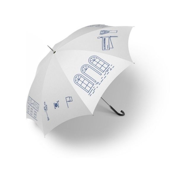 Guarda-chuva branco com estampas de ícones desenhados em azul marinho, retirados de elementos da arquitetura do prédio XV de Novembro. Pega/base de madeira.